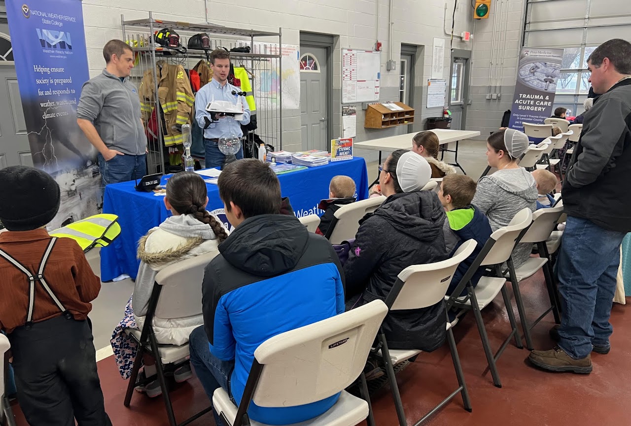 Staff from NWS State College, PA, teach Amish children about weather safety at a Farm and Family Safety Day outreach event. 